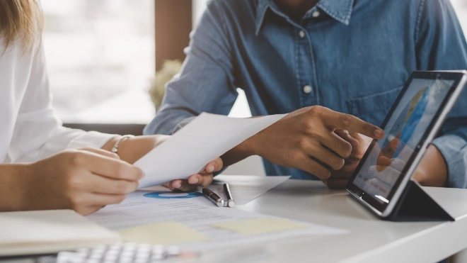 business meeting looking at data and discussing