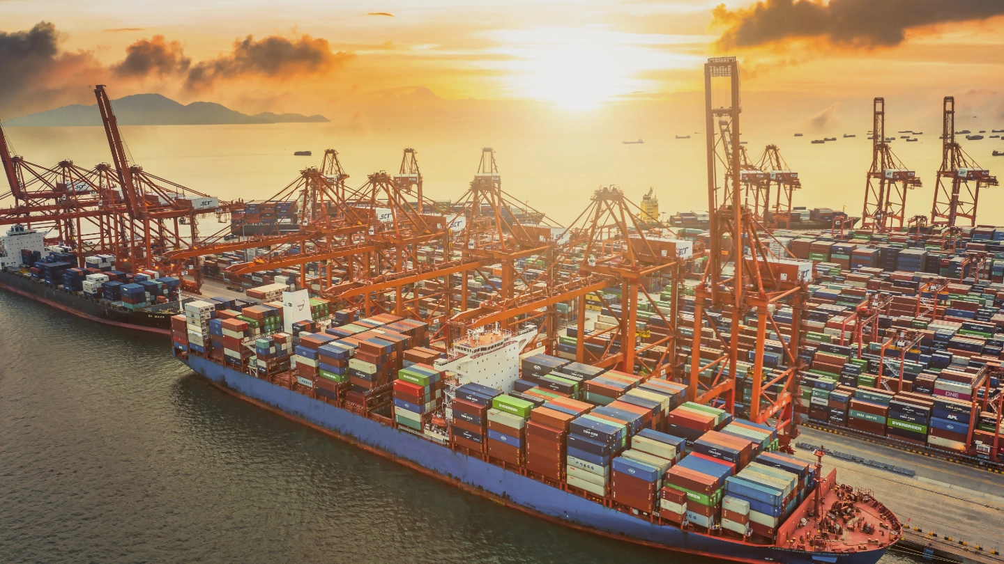 Aerial view of large ship in dock with containers image