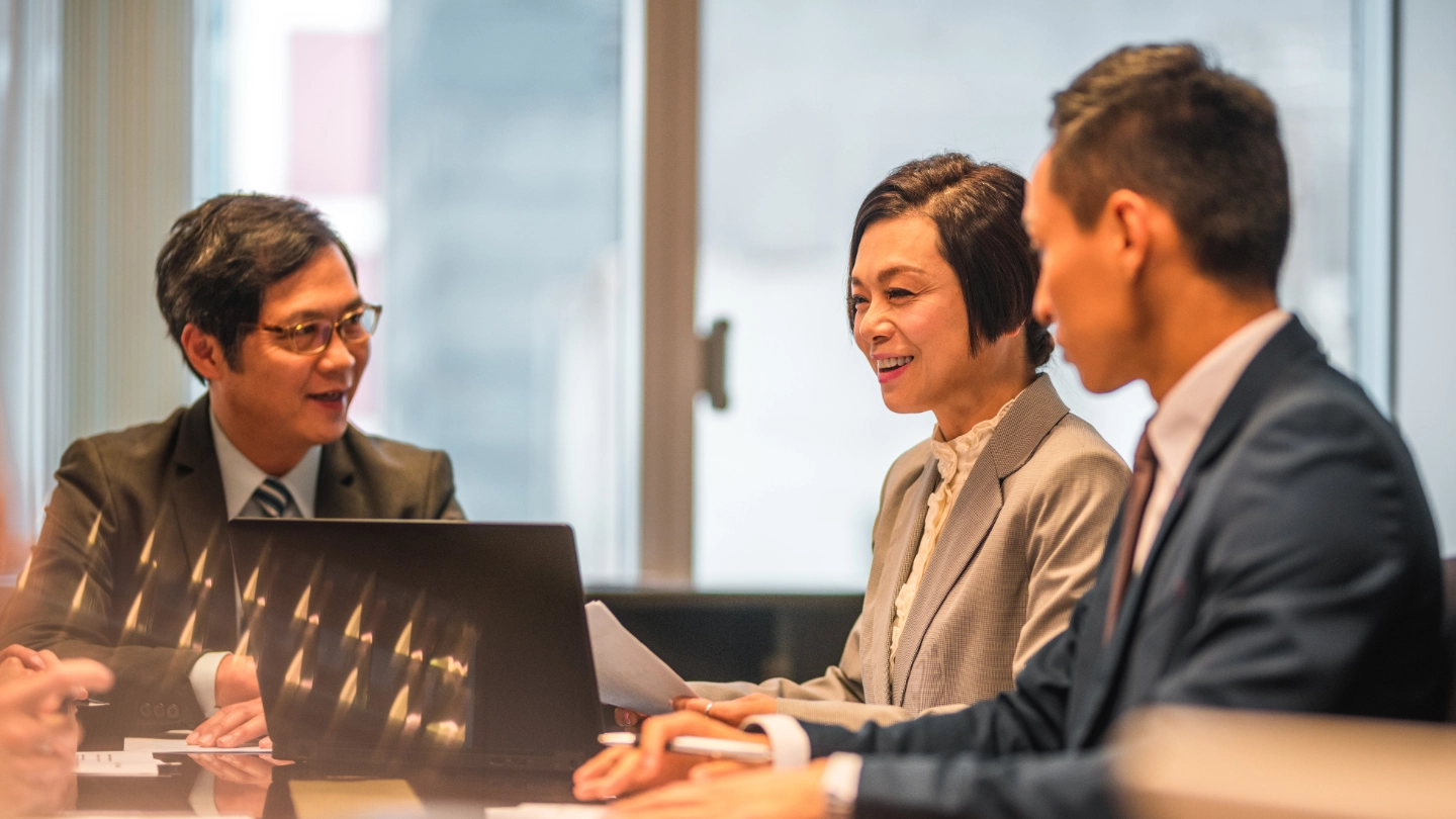 Business meeting with three people image